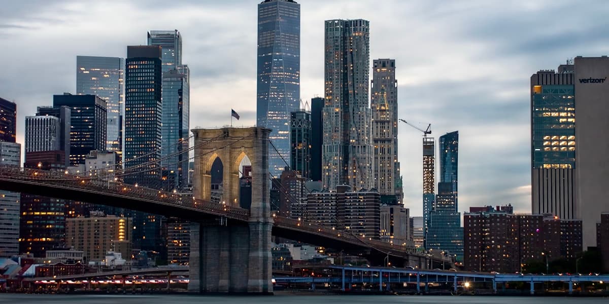 New York City skyline with Brooklyn Bridge at dusk